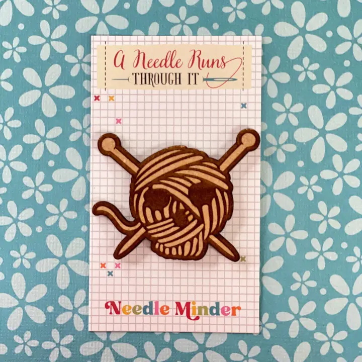 Needle Minders